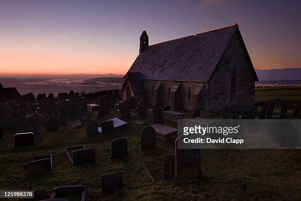 dusk on hillside at small chapel at llandecwyn, snowdonia, wales - welsh hills stock pictures, royalty-free photos & images