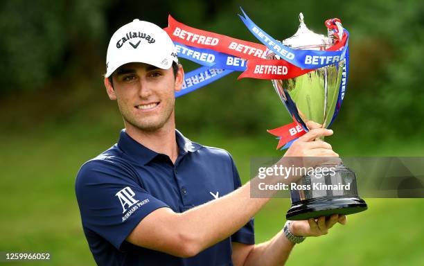 Renato Paratore of Italy with the winners trophy after the final round of the Betfred British Masters at Close House Golf Club on July 25, 2020 in...
