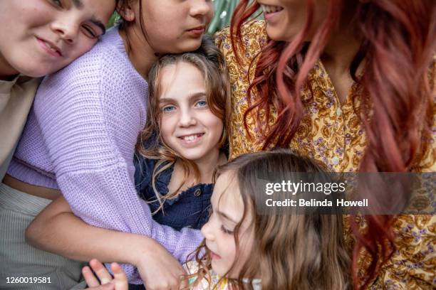 multigenerational aboriginal family spends time together in the family home - australian family time stock-fotos und bilder