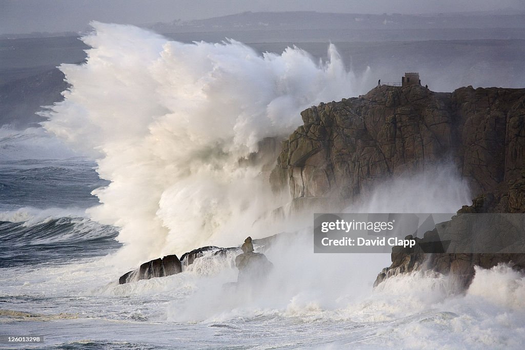 Winter storms hit the rocky coastline with monumental force at Land's End in Cornwall.