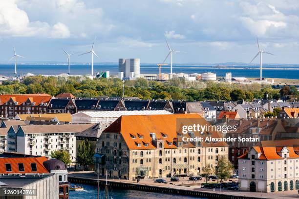 copenhagen skyline with wind turbines in the background, denmark - windmill denmark stock pictures, royalty-free photos & images