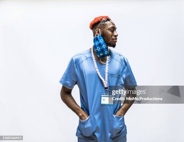 studio portrait of male doctor/healthcare worker - quarantine stock pictures, royalty-free photos & images