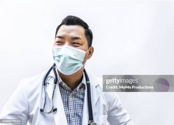 studio portrait of doctor/healthcare worker - hero image stock pictures, royalty-free photos & images