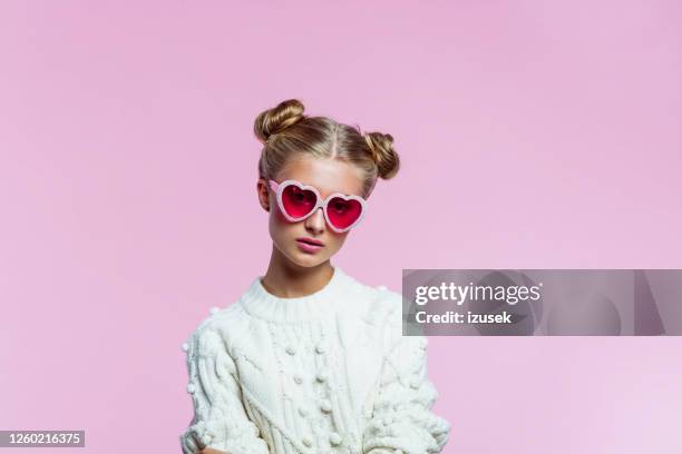 beautiful teenege girl wearing heart shaped sunglasses - heart sunglasses stock pictures, royalty-free photos & images