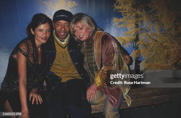 Portrait of, from left, Danish model Helena Christensen, American music executive and businessman Russell Simmons, and English actress Elaine Paige...
