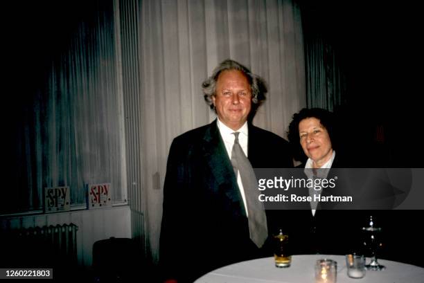 Portrait of Canadian journalist and magazine editor Graydon Carter and American author Fran Lebowitz attend a party for Spy magazine at the Puck...