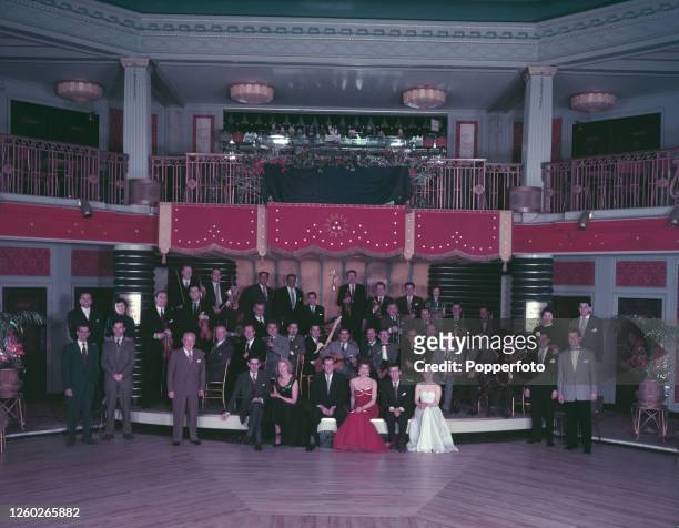 Musicians, instrumentalists and singers, all members of Ted Heath's big band, posed together at a dance hall in England in December 1954. Musicians...