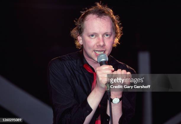 English New Wave, Pop, and Jazz musician Joe Jackson performs onstage at the Capitol Theatre, Passaic, New Jersey, February 15, 1980. A large Union...