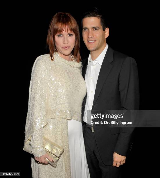 Actress Molly Ringwald and her husband Panio Gianopoulos arrive at the 36th Annual Los Angeles Film Critics Association Awards at InterContinental...
