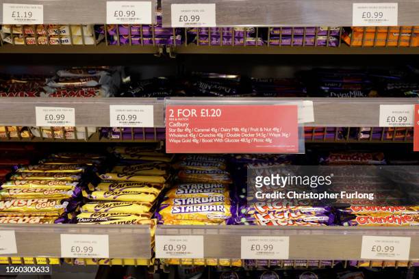 Reduced price deal is seen advertising chocolate confectionery in a shop on July 27, 2020 in Birmingham, United Kingdom. The British government plans...