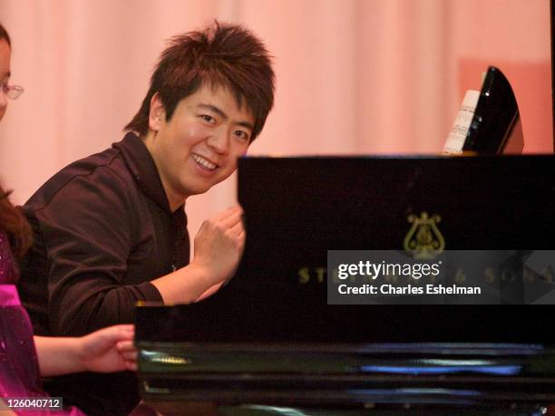 Pianist Lang Lang performs at PS 334 - The Anderson School on January 3, 2011 in New York City.