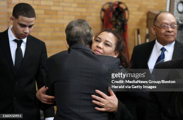 Leonel Rondon's mother, Rosaly Rondon, embraces attorney Doug Sheff following a news conference announcing new federal pipeline legislation named...