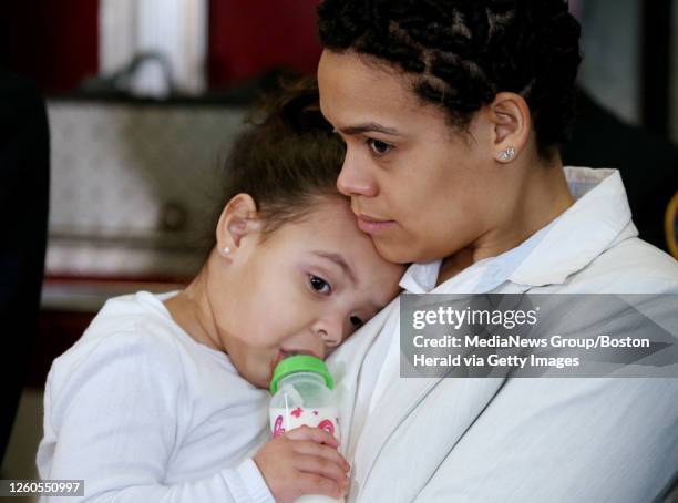 Leonel Rondon's sister, Lucianny Rondon, holds her daughter, Rihanny during a news conference announcing new federal pipeline legislation named after...