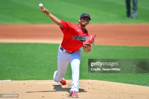 Starting pitcher Carlos Carrasco of the Cleveland Indians warms up during the first inning against the Kansas City Royals at Progressive Field on...