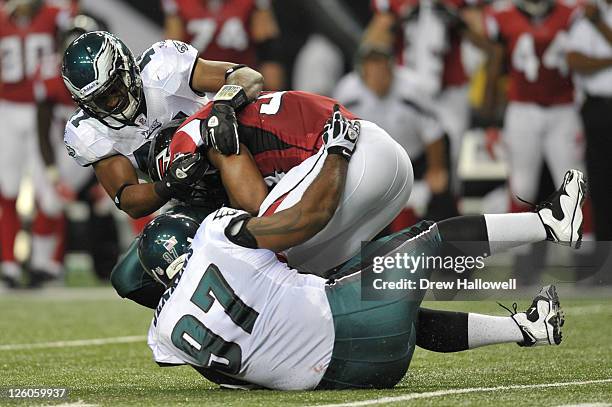 Jarrad Page of the Philadelphia Eagles makes a tackle during the game against the Atlanta Falcons at the Georgia Dome on September 18, 2011 in...