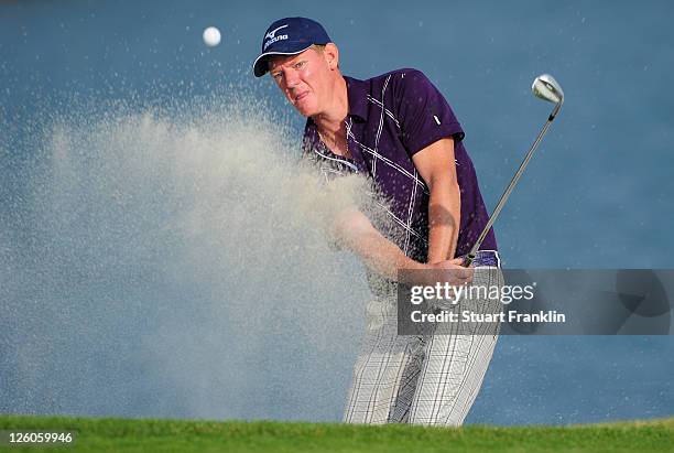 Daniel Gaunt of Australia plays a bunker shot during the first round of the Austrian Golf Open presented by Lyoness at the Diamond Country Club on...