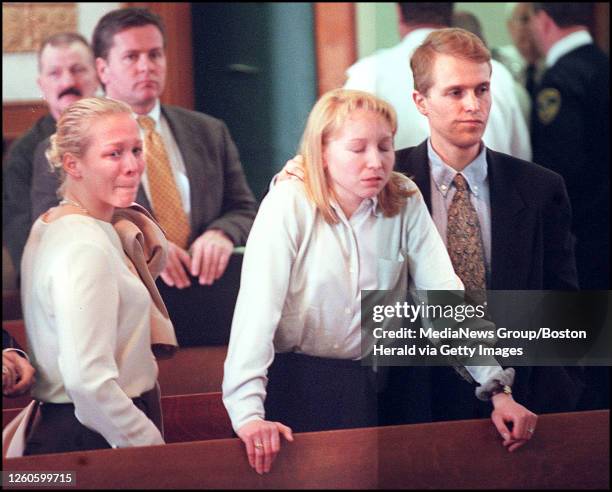 Accused wife murderer, Dr. Dirk Greineder's kids, son Colin and daughters Britt and Kirsten break down at his arraignment. Staff Photo By Matt Stone...