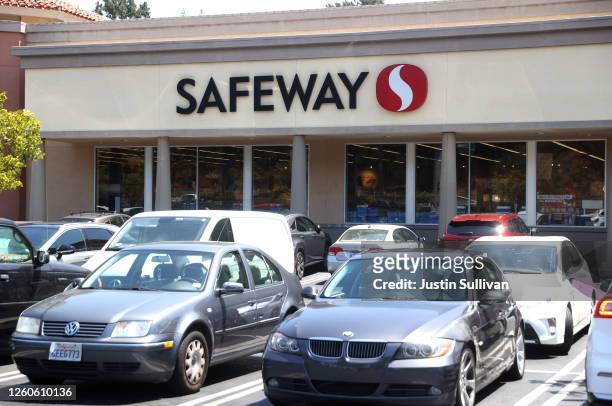 Cars sit parked in front of a Safeway store on July 27, 2020 in Mill Valley, California. Albertsons, parent company of Safeway and one of the largest...