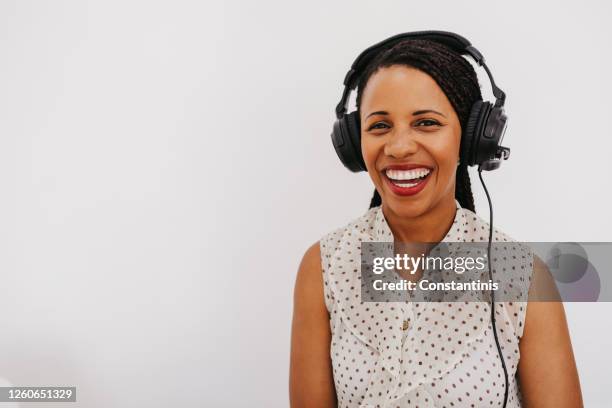 radio host at work - headphones white background stock pictures, royalty-free photos & images