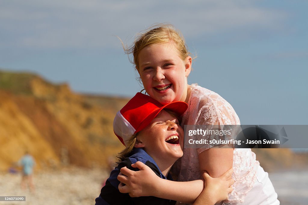 Siblings hugging