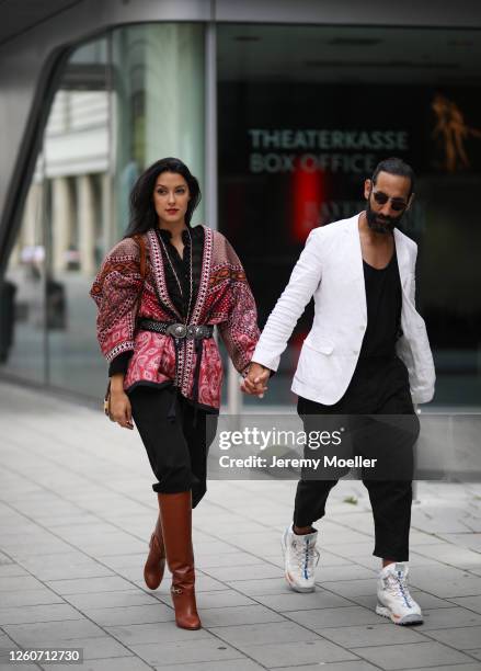 Rebecca Mir wearing a complete Etro look and bag and Massimo Sinato on July 21, 2020 in Munich, Germany.