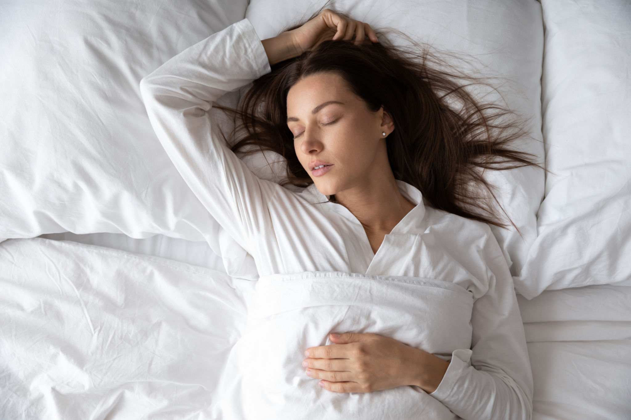 Top view gorgeous woman is in state of deep sleep Top view gorgeous woman is in state of deep sleep