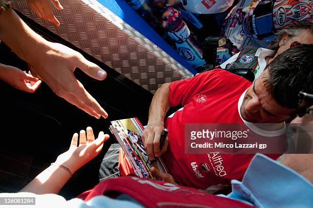 Carlos Checa of Spain and Althea Racing during an autograph signing session during the Superbike World Championship Round Eleven at Autodromo Enzo e...