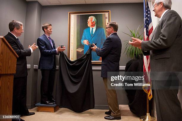 From left, Sen. Mark Kirk, R-Ill., Reps. Aaron Schock, R-Ill., Bobby Schilling, R-Ill., and Senate Historian Donald Ritchie unveil a portrait of...