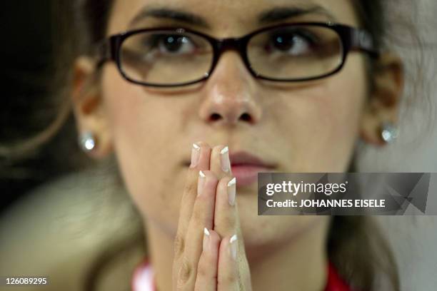 An altar server attends the mass held by Pope Benedict XVI at the Olympic stadium in Berlin on September 22 on the first day of his first state visit...