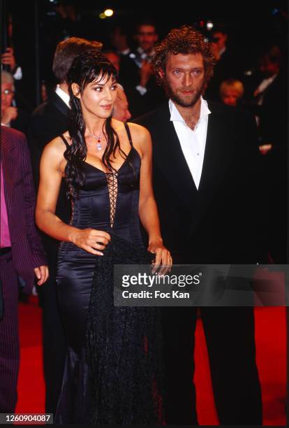 Monica Bellucci and Vincent Cassel attend the 55th Cannes Film Festival in May 2002, in Cannes, France.