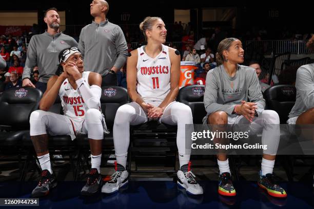 Brittney Sykes, Elena Delle Donne and Natasha Cloud of the Washington Mystics sit on the bench before the game against the Atlanta Dream on June 28,...