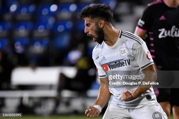 Diego Rossi of Los Angeles FC celebrates after scoring the opening goal of the match from the penalty spot during a round of 16 match of the MLS is...