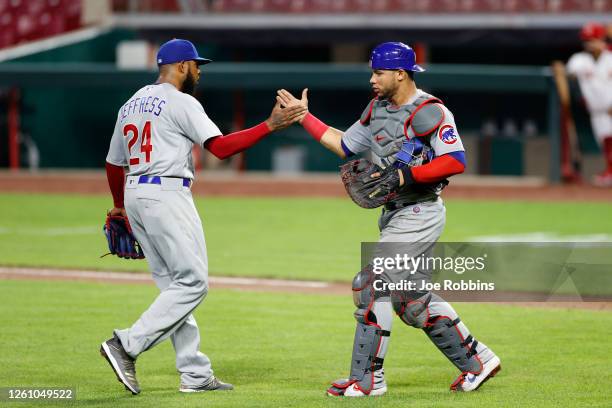 Jeremy Jeffress and Willson Contreras of the Chicago Cubs celebrate after the final out of the game against the Cincinnati Reds at Great American...