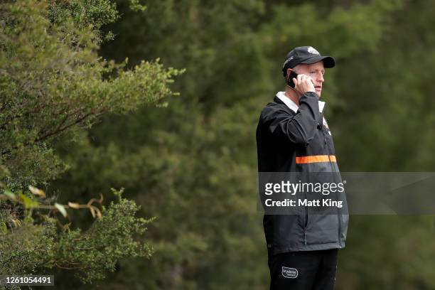 Tigers head coach Michael Maguire talks on a phone during a Wests Tigers NRL training session at St. Luke's Park North on July 28, 2020 in Sydney,...