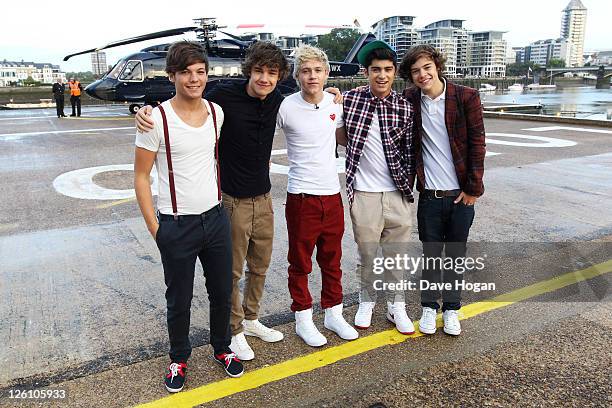 Harry Styles, Liam Payne, Niall Horan, Louis Tomlinson and Zayn Malik of One Direction travel in a luxury helicopter to Glasgow, Manchester and...