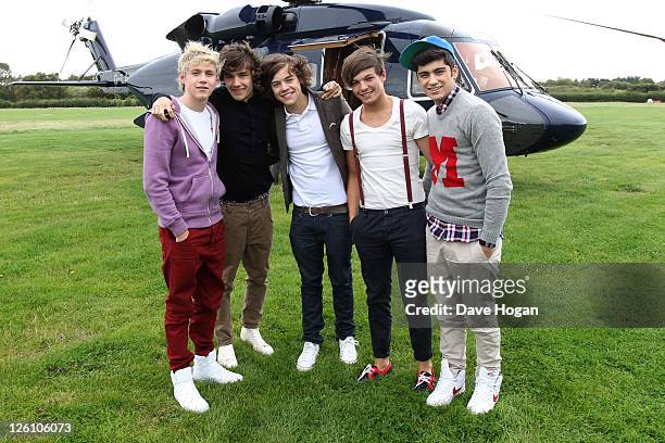 Niall Horan, Louis Tomlinson, Harry Styles, Liam Payne and Zayn Malik of One Direction travel in a luxury helicopter to Glasgow, Manchester and...