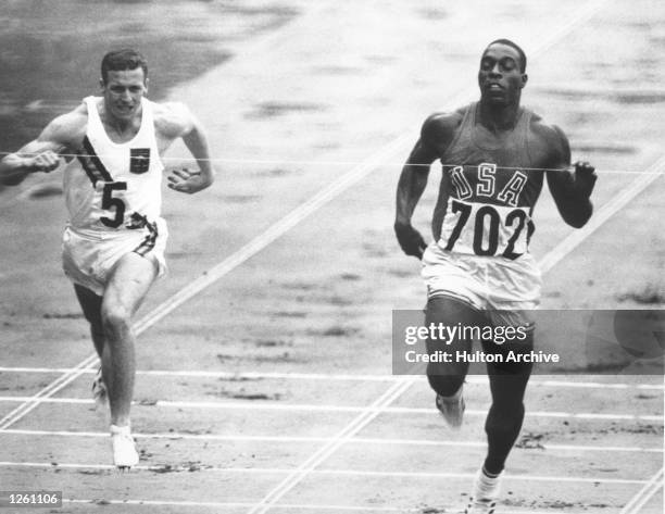 Robert Hayes of the United States wins his heat in the Men's 100 Metres at the Olympic Games in Tokyo.