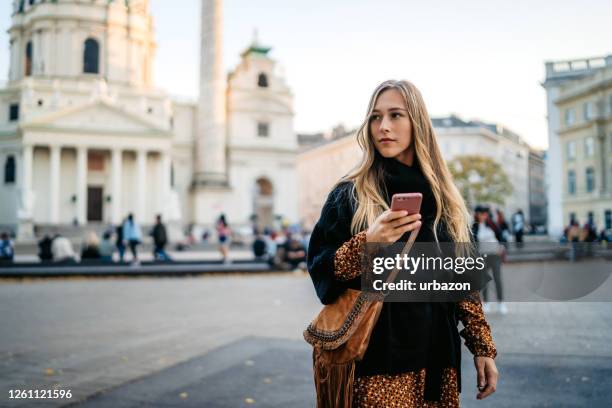 woman text messaging in vienna - vienna austria stock pictures, royalty-free photos & images