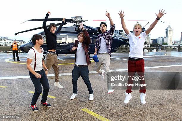 Liam Payne, Louis Tomlinson, Harry Styles, Zayn Malik and Niall Horan of One Direction travel in a luxury helicopter to Glasgow, Manchester and...