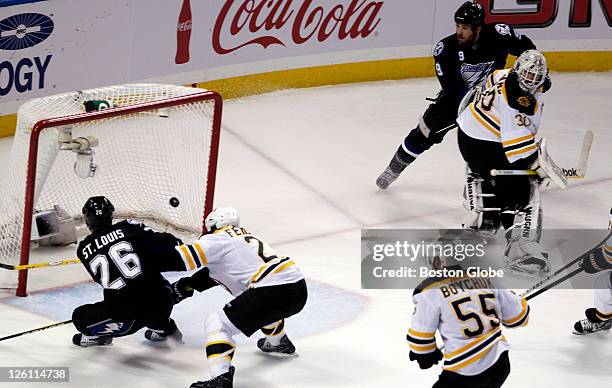 Tampa Bay's Martin St. Louis scores what would be the game winning goal, as he took a great pass from teammate Steve Downie , who pulled Bruins...