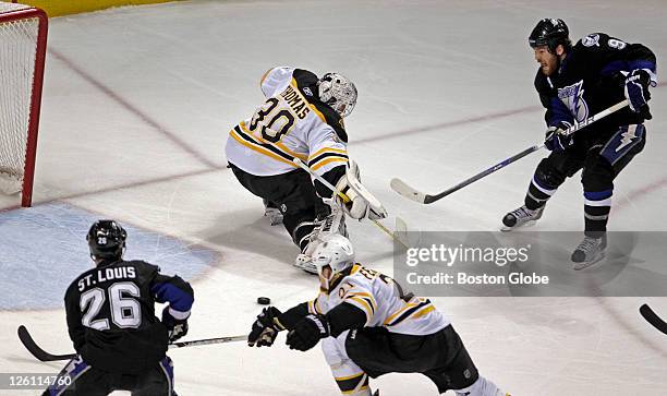 Tampa Bay's Martin St. Louis scores what would be the game winning goal, as he took a great pass from teammate Steve Downie , who pulled Bruins...