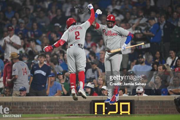 Josh Harrison of the Philadelphia Phillies celebrates at home plate with Edmundo Sosa after hitting a home run in the fifth inning against the...