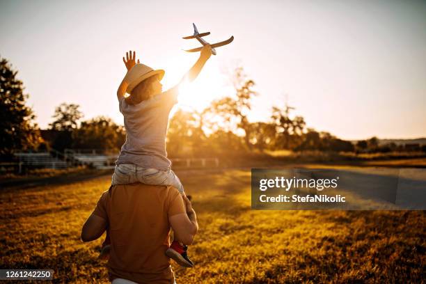 let's fly - park family sunset stock pictures, royalty-free photos & images