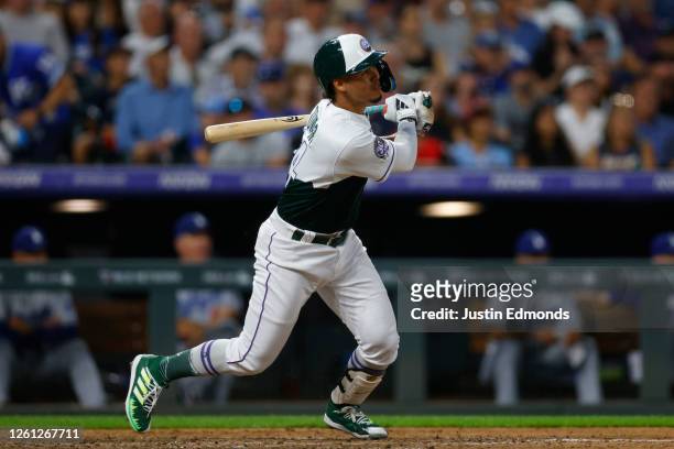 Ezequiel Tovar of the Colorado Rockies hits a three RBI double in the sixth inning against the Los Angeles Dodgers at Coors Field on June 28, 2023 in...