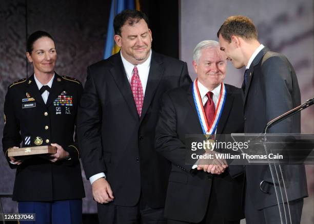 Former U.S. Secretary of Defense Dr. Robert M. Gates (is awarded the 2011 Liberty Medal by Captain Anthony Odierno as Sergeant First Class Dana...