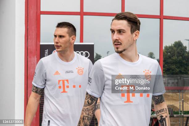 Niklas Suele and Adrian Fein of FC Bayern Muenchen arrive for a training session at Saebener Strasse training ground on July 26, 2020 in Munich,...