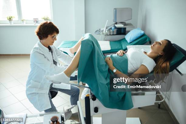 pregnant woman at gynecologist - gynaecologist stock pictures, royalty-free photos & images