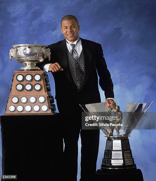 Jarome Iginla of the Calgary Flames poses with the Art Ross Trophy and the Maurice "Rocket" Richard Trophy during the NHL Awards in the John Bassett...