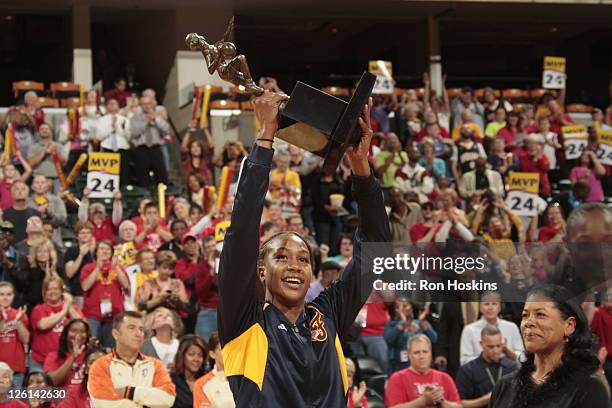 Tamika Catchings of the Indiana Fever lifts the MVP Trophy prior to game one of the WNBA Eastern Conference Finals at Conseco Fieldhouse on September...