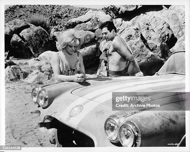 Mimsy Farmer and Paul Bertoya reflect for a moment in a scene from the film 'Hot Rods To Hell', 1966.